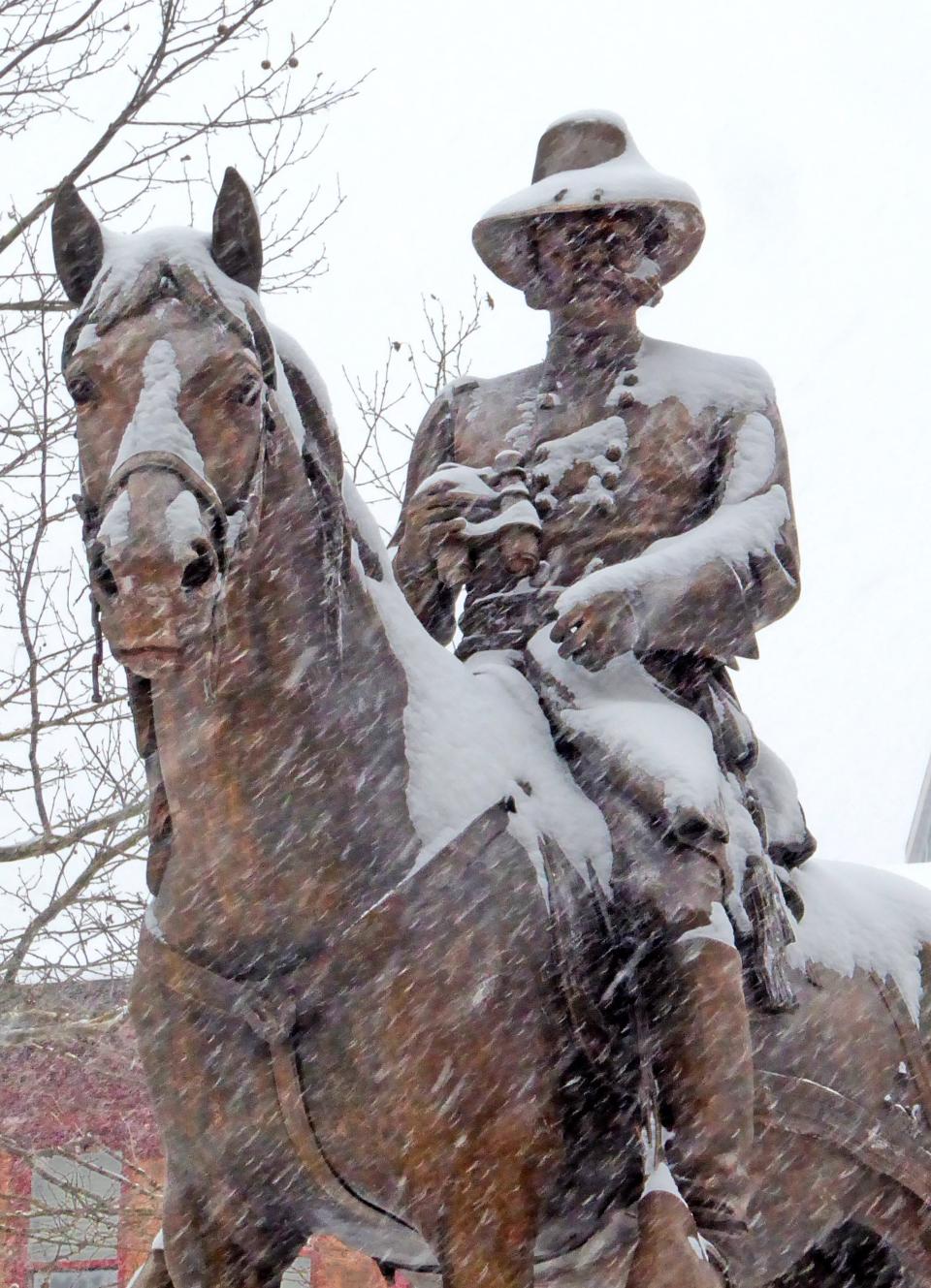 A snow-covered bronze statue of Rhode Island Governor, Senator, and Civil War General Ambrose Burnside on horseback.