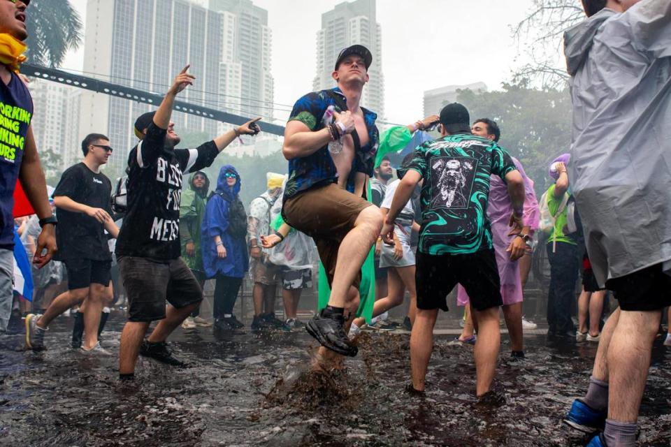 Montreal, Canada native Maxine St-Amour Bélanger dances in the ankle-high rainwater during Ultra 2024 at Bayfront Park in Downtown Miami on Friday, March 22, 2024.