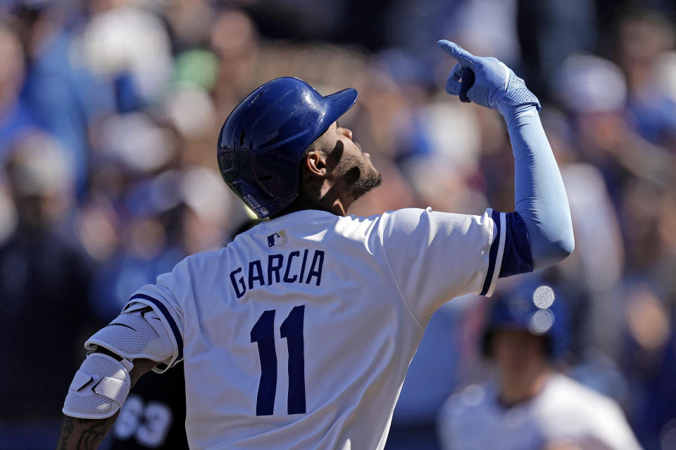 Kansas City Royals' Maikel Garcia celebrates after hitting a solo home run during the first inning of a baseball game against the Minnesota Twins Thursday, March 28, 2024, in Kansas City, Mo. (AP Photo/Charlie Riedel)