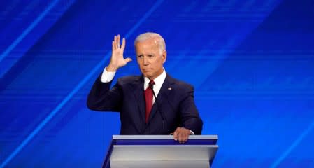 FILE PHOTO: Former Vice President Joe Biden gestures during the 2020 Democratic U.S. presidential debate in Houston