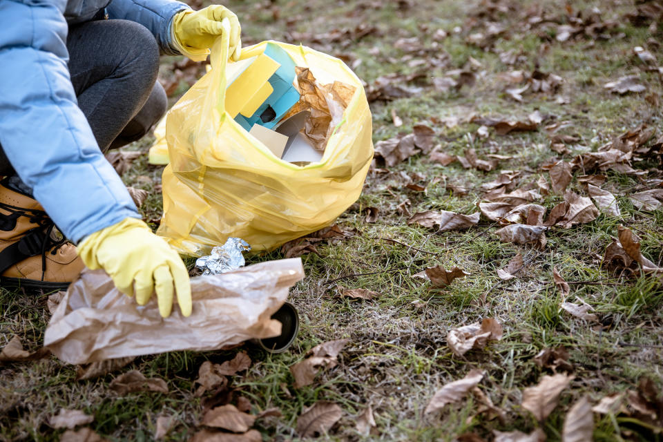 Someone picking up trash