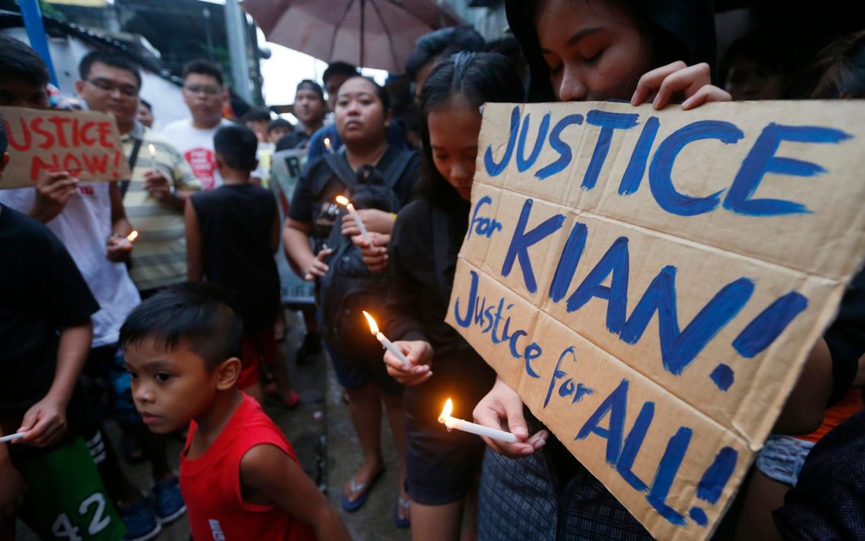 Seventeen-year-old Kian Delos Santos was allegedly shot three times by undercover police officers - AP