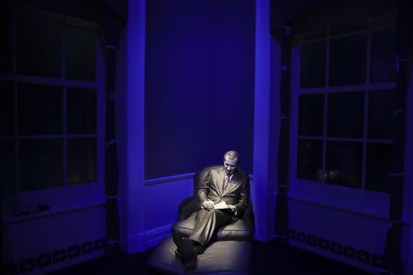 In this Wednesday, Oct. 5, 2016 photo, a sculpture of former President Richard Nixon at the Lincoln Sitting Room with a notepad is on display in the museum at the Richard Nixon Presidential Library and Museum in Yorba Linda, Calif. The museum will reopen Friday, Oct. 14, following a $15 million makeover aimed at bringing the country's 37th president closer to younger generations less familiar with his groundbreaking trip to China or the Watergate scandal. (AP Photo/Jae C. Hong)