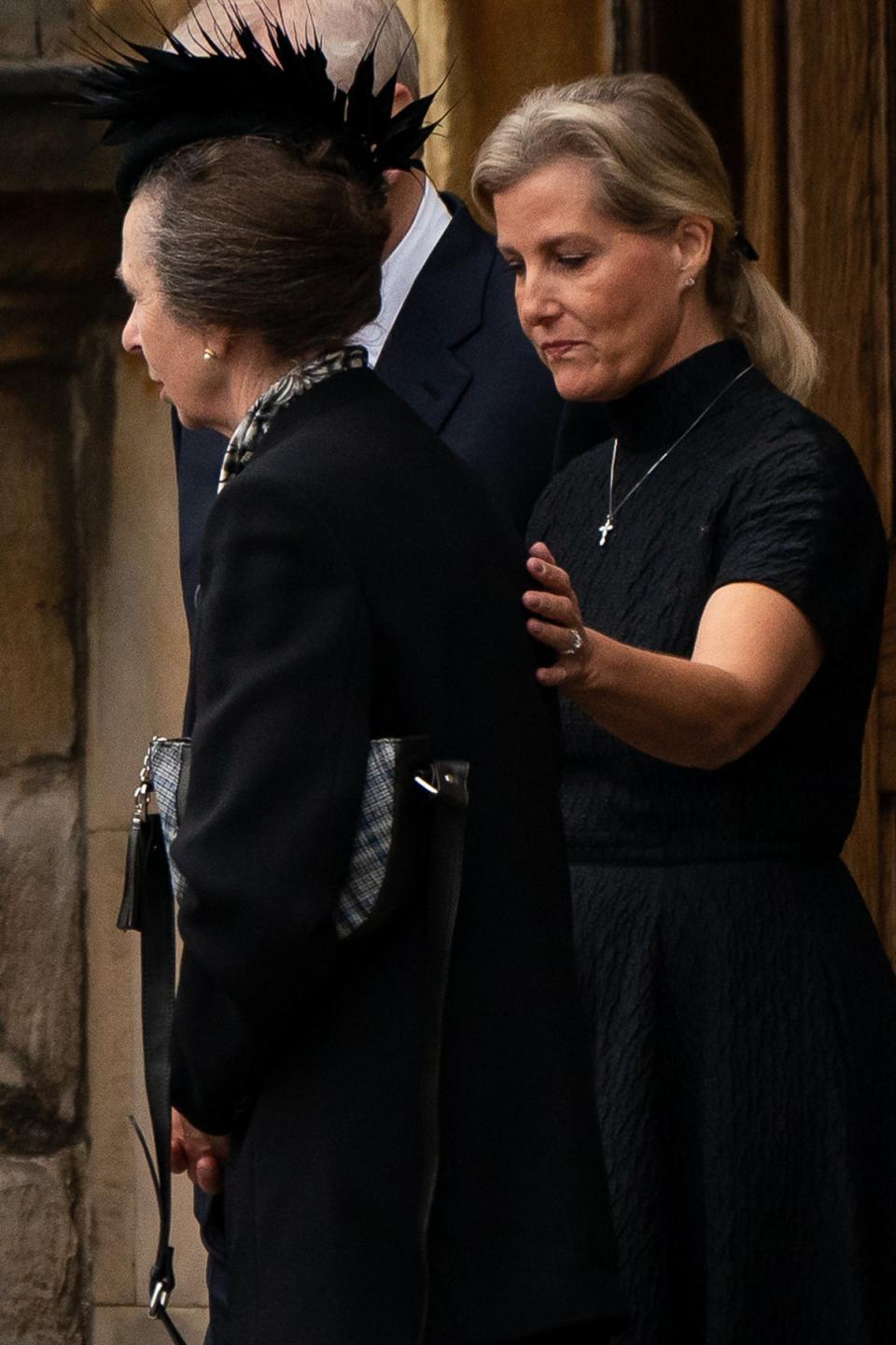 The Princess Royal is comforted by the Countess of Wessex as the coffin of Queen Elizabeth II, draped with the Royal Standard of Scotland, completes its journey from Balmoral to the Palace of Holyroodhouse in Edinburgh (PA/Aaron Chown)