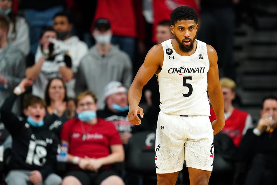 Cincinnati Bearcats guard David DeJulius (5) gets back on defense after making a 3-point basket in the first half of an NCAA menÕs college basketball game against the Southern Methodist Mustangs, Thursday, Jan. 6, 2022, at Fifth Third Arena in Cincinnati.
