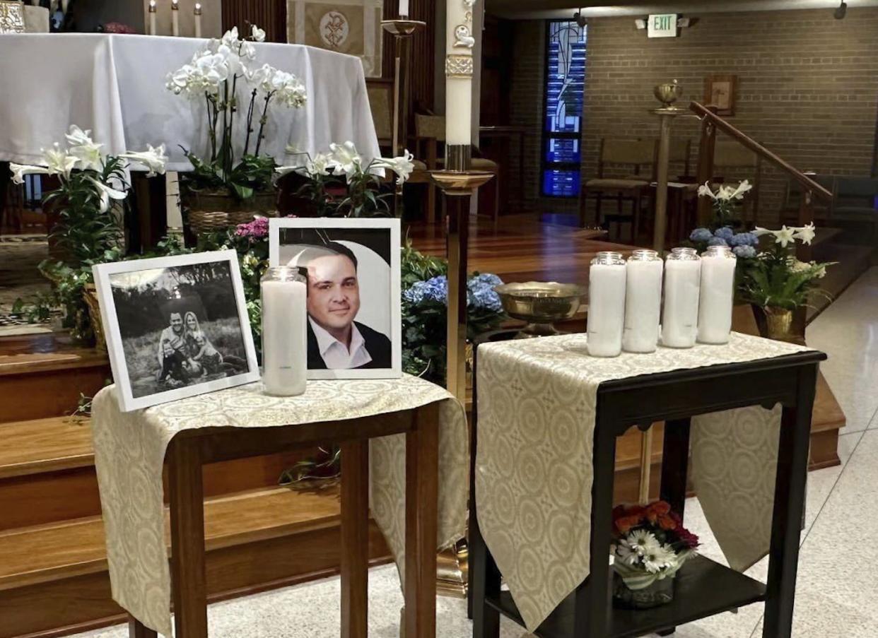 A memorial for Joshua Barrick, killed by a shooter at the bank where he worked, April 10, 2023, at Holy Trinity Catholic Church in Louisville, Ky. <a href="https://newsroom.ap.org/detail/LouisvilleShooting/d3427bc6b22a4988a4b73b1672f1d6f3/photo?Query=shooting%20louisville&mediaType=photo&sortBy=arrivaldatetime:desc&dateRange=Anytime&totalCount=508&currentItemNo=0" rel="nofollow noopener" target="_blank" data-ylk="slk:AP Photo/Claire Galofaro;elm:context_link;itc:0;sec:content-canvas" class="link ">AP Photo/Claire Galofaro</a>