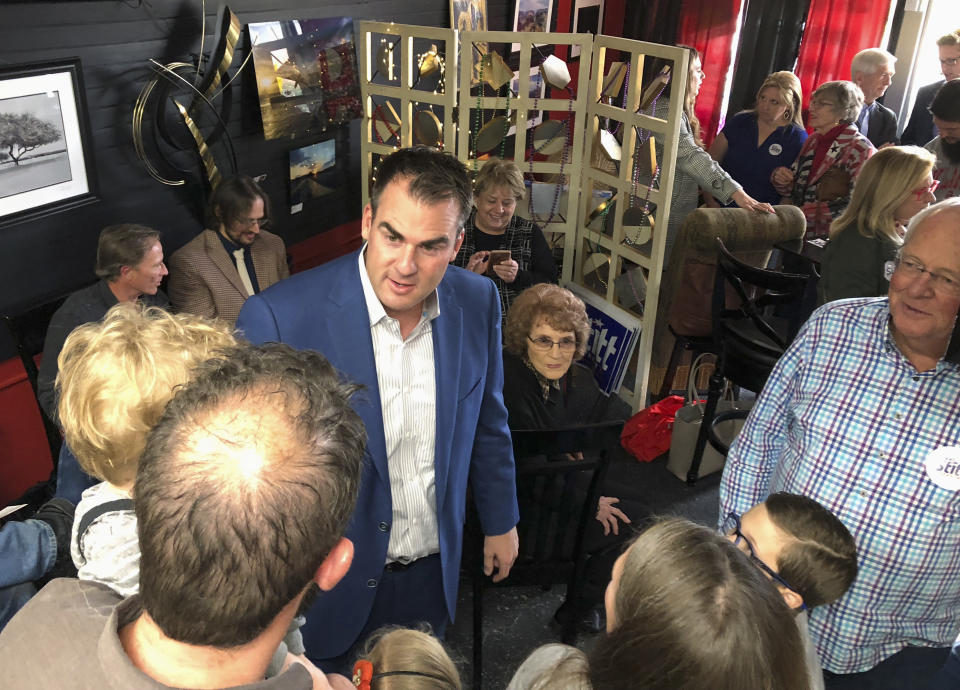 In this Oct. 12, 2018, photo, Kevin Stitt, the Republican nominee for Oklahoma governor, greets guests at Java 39 coffeehouse in Bethany, Okla. Stitt is locked in a tight race with Democrat Drew Edmondson to replace term-limited GOP Gov. Mary Fallin. (AP Photo/Sean Murphy)