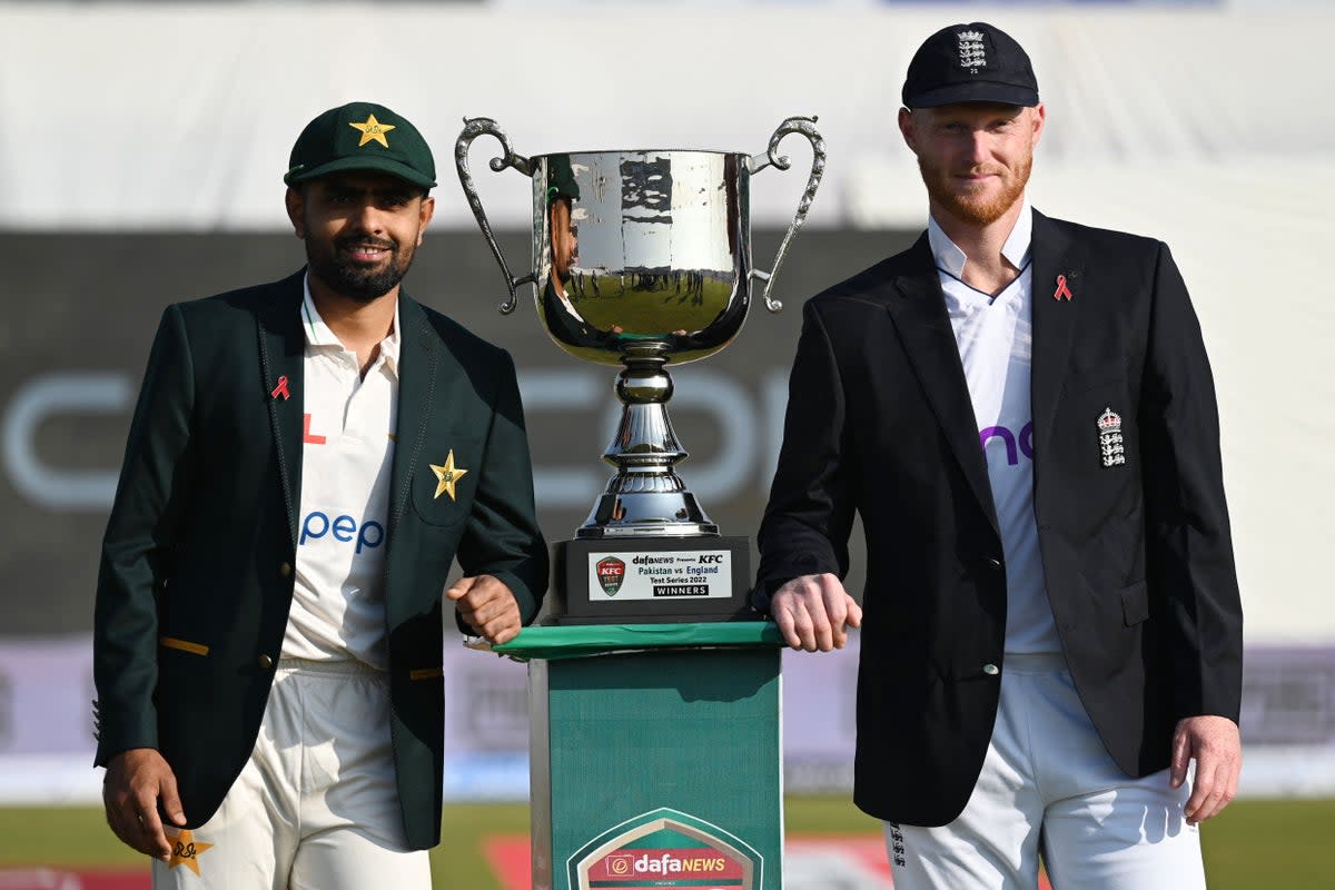 Pakistan's captain Babar Azam (L) and his England's counterpart Ben Stokes pose with the Test series trophy (AFP via Getty Images)