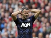 Manchester United's Ryan Giggs reacts during their English Premier League soccer match against Liverpool at Anfield, Liverpool, northern England September 1, 2013. REUTERS/Phil Noble