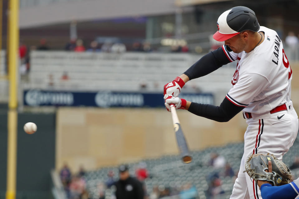 Minnesota Twins' Trevor Larnach hits an RBI single against the Kansas City Royals during the first inning of a baseball game Thursday, April 27, 2023, in Minneapolis. (AP Photo/Bruce Kluckhohn)
