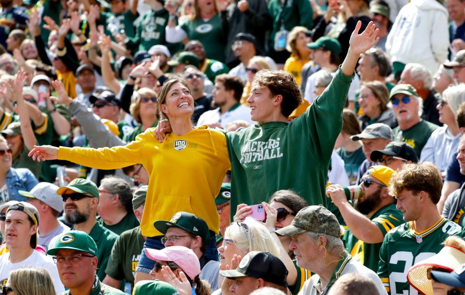 Green Bay Packers fans dance to "Roll out the Barrell" during the Aug. 26 preseason game  against the Seattle Seahawks oat Lambeau Field in Green Bay.