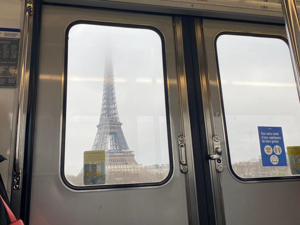 view of Eiffel tower in paris from a subway car