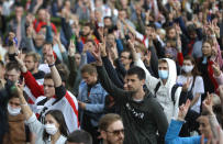 People gesture during a protest at the Independence Square in Minsk, Belarus, Thursday, Aug. 27, 2020. Police in Belarus have dispersed protesters who gathered on the capital's central square, detaining dozens. (AP Photo/Sergei Grits)