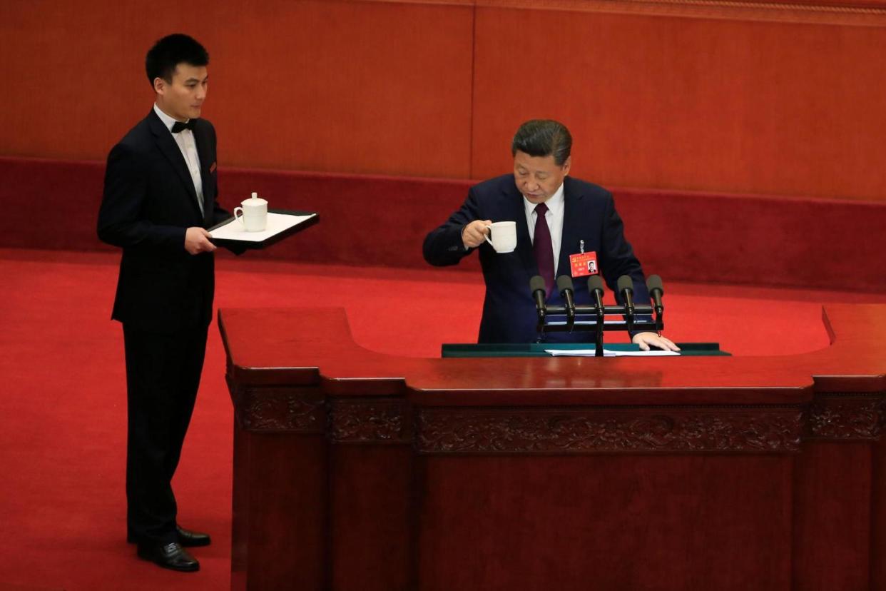 Chinese president Xi Jinping is served tea during his lengthy address: REUTERS