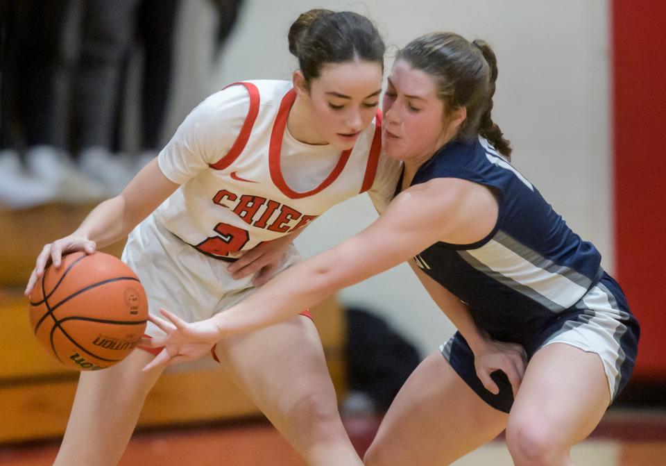 Fieldcrest's Carolyn Megow tries to knock the ball away from Dee-Mack's Dalia DeJesus in the second half Thursday, Feb. 2, 2023 in Mackinaw. The Knights defeated the Chiefs 62-54.