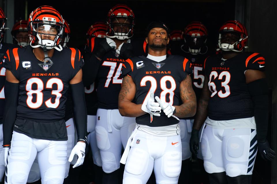 Cincinnati Bengals wide receiver Tyler Boyd (83), Cincinnati Bengals running back Joe Mixon (28) and the Cincinnati Bengals offense get set to take the field before kickoff of the first quarter during a Week 13 NFL football game, Sunday, Dec. 5, 2021, at Paul Brown Stadium in Cincinnati. The Los Angeles Chargers defeated the Cincinnati Bengals, 41-22. 