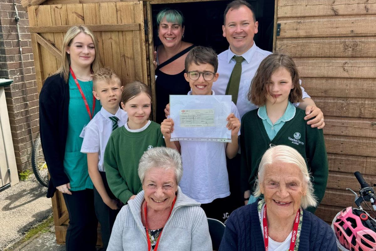 Staff and pupils in the new shop <i>(Image: Hawkes Farm Academy)</i>