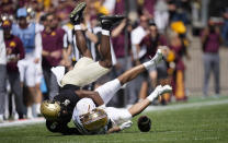 Colorado safety Mark Perry, top, tackles Minnesota wide receiver Chris Autman-Bell after he caught a pass in the second half of an NCAA college football game Saturday, Sept. 18, 2021, in Boulder, Colo. Minnesota won 30-0. (AP Photo/David Zalubowski)