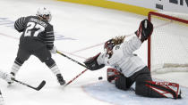 Canada goalie Ann-Renee Desbiens (35) stops a United States' Annie Pankowski (27) shot during the first period in the women's 3-on-3 game, part of the NHL hockey All-Star weekend, Friday, Jan. 24, 2020, in St. Louis. (AP Photo/Jeff Roberson)