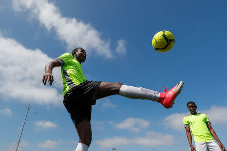 Asylum seekers take part in the soccer tournament "All on the pitch" organised by NGO's and Belgian Football Association at the occasion of the World Refugee Day, in Deurne, Belgium June 20, 2018. REUTERS/Yves Herman