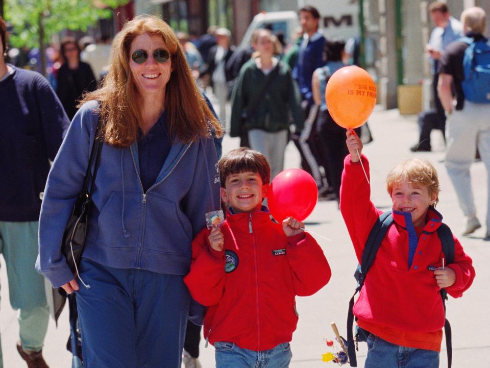 Caroline Kennedy Schlossberg walks with her son Jack and a school friend in April 1999