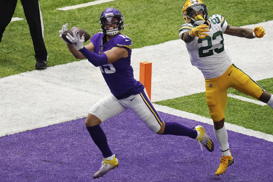 Minnesota Vikings wide receiver Adam Thielen (19) hauled in a touchdown pass as Green Bay Packers cornerback Jaire Alexander (23) tries to defend in the second half of an NFL football game Sunday, Sept. 13, 2020, in Minneapolis, Minn. (Anthony Souffle/Star Tribune via AP)