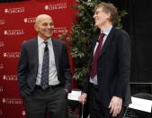 University of Chicago professors Eugene F. Fama (L) and Lars Hansen share a laugh at the end of a news conference after it was announced they won the 2013 Nobel Prize in Economics in Chicago, October 14, 2013. REUTERS/Jim Young