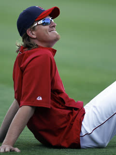 Jered Weaver warms up for Tuesday's game against the White Sox. Weaver's five-year contract extension was officially announced prior to the game