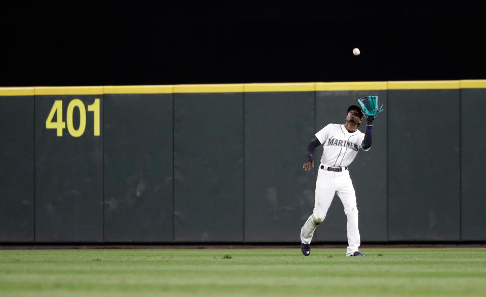 Dee Gordon converted to center after seven seasons at second base. (AP Photo/Ted S. Warren)