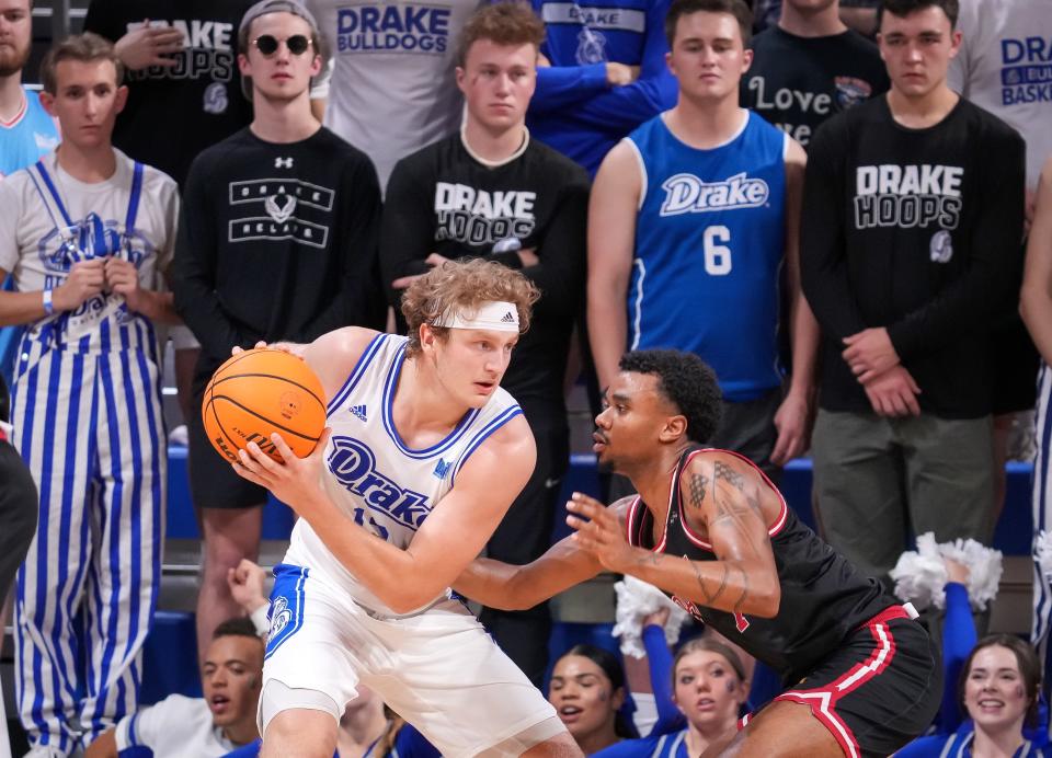 Drake guard Tucker DeVries, left, looks to move the ball to the basket in the first half against IUPUI earlier this season