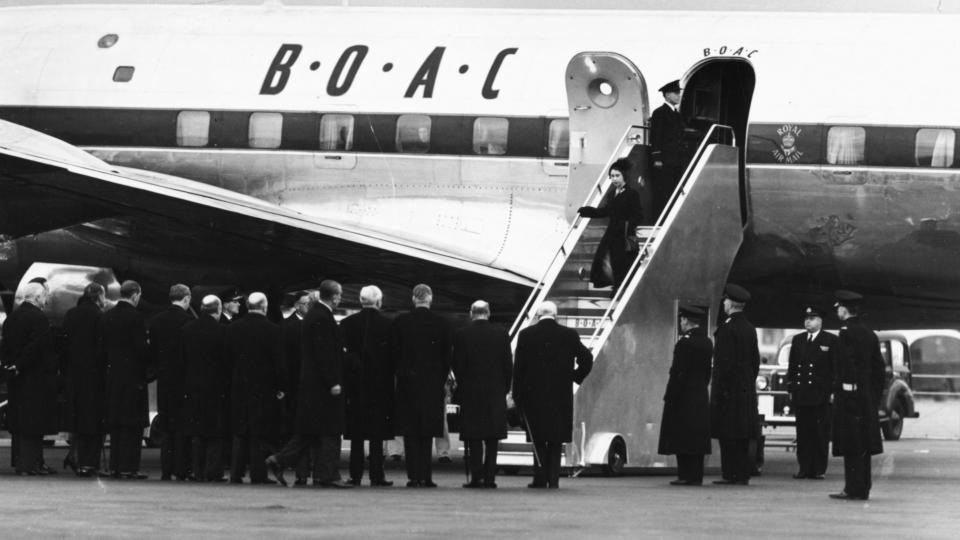 Queen Elizabeth II and Prince Philip, the Duke of Edinburgh, leaving their BOAC airliner as they return from Kenya following the death of King George VI and Elizabeth's accession to the throne, London, February 7th 1952.