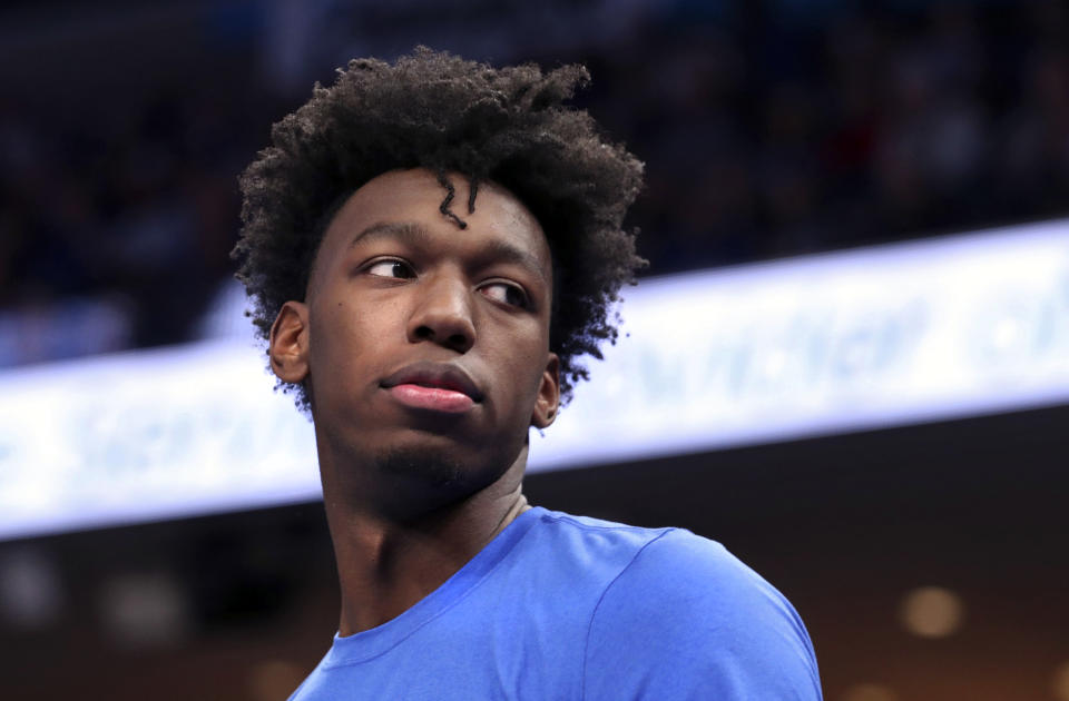 FILE - In this Wednesday, Nov. 20, 2019, file photo, Memphis' James Wiseman watches from the bench during the first half of the team's NCAA college basketball game against Little Rock in Memphis, Tenn. Wiseman says he has withdrawn from school as the likely NBA lottery pick gets ready to begin his pro career. (AP Photo/Karen Pulfer Focht, File)