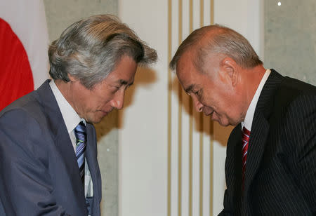 Japanese Prime Minister Junichiro Koizumi (L) and Uzbekistan's President Islam Karimov greet each other after a bilateral meeting in Tashkent, Uzbekistan, August 29, 2006. REUTERS/Shamil Zhumatov/File Photo