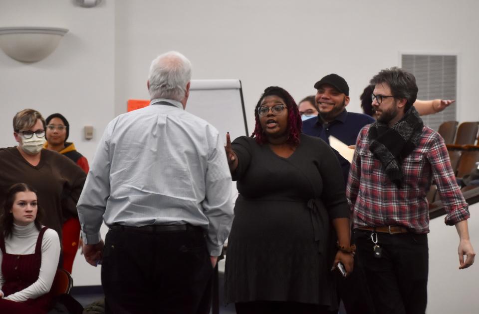 Shanel Boyce points at Binghamton City School District Board of Education President Brian Whalen as he advances toward another Black woman speaker at the Jan. 24 meeting, obscured from this angle by the growing swarm of audience members who surrounded her.