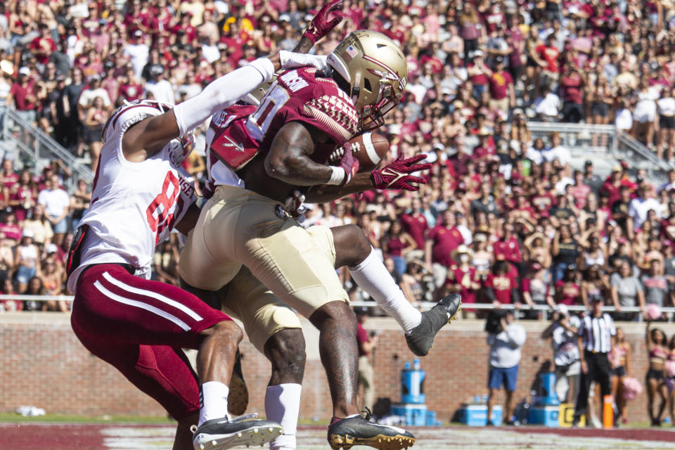 Florida State defensive back Jammie Robinson (10) intercepts a pass in the end zone in the first half of an NCAA college football game against Massachusetts in Tallahassee, Fla., Saturday, Oct. 23, 2021. (AP Photo/Mark Wallheiser)