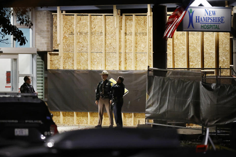 Police stand at the entrance to New Hampshire Hospital, Friday, Nov. 17, 2023, in Concord, N.H. A fatal shooting at the New Hampshire psychiatric hospital Friday ended with the suspect dead, police said. New Hampshire Hospital is the state psychiatric hospital, located in the state’s capital city. (AP Photo/Michael Dwyer)