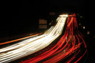 In this long exposure photo, motor vehicles move along Interstate 276 in Feasterville, Pa., Thursday, Dec. 21, 2023. (AP Photo/Matt Rourke)