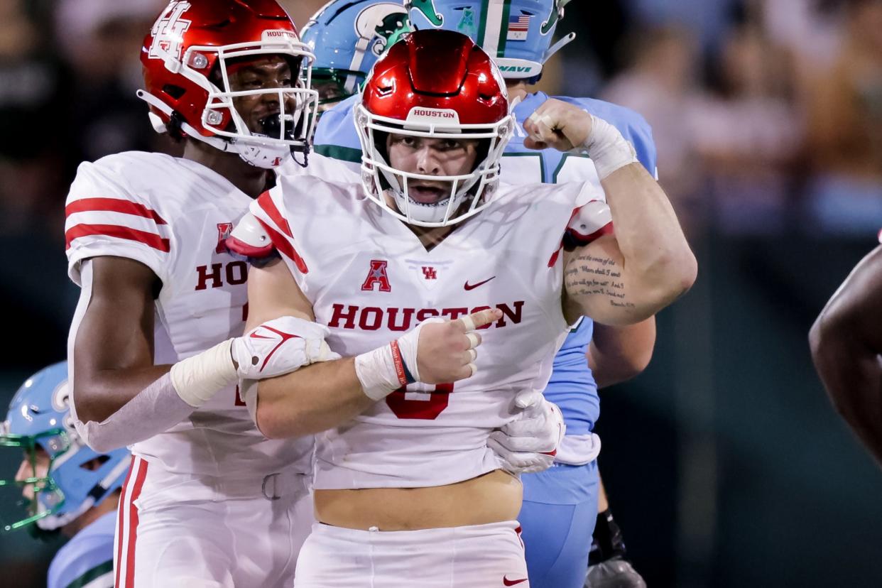 Derek Parish (0) celebrates a sack of Tulane quarterback Michael Pratt during a 2021 game in New Orleans when Parish played for the University of Houston.