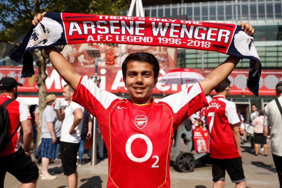 <p>Soccer Football – Premier League – Arsenal vs Burnley – Emirates Stadium, London, Britain – May 6, 2018 General view fans hold up a scarf in reference to Arsenal manager Arsene Wenger outside the stadium before the match Action Images via Reuters/Matthew Childs EDITORIAL USE ONLY. No use with unauthorized audio, video, data, fixture lists, club/league logos or “live” services. Online in-match use limited to 75 images, no video emulation. No use in betting, games or single club/league/player publications. Please contact your account representative for further details. </p>