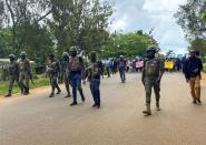 Schoolchildren, their parents and teachers hold a protest after gunmen opened fire at a school, killing at least six children as authorities claim, in Kumba