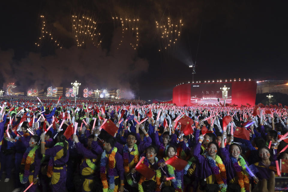 Pyrotechnics create the words "Long Live the People" during the gala evening held on Tiananmen Square for the 70th anniversary of the founding of the People's Republic of China in Beijing on Tuesday, Oct. 1, 2019. Tiananmen Square is both where leader Mao Zedong declared the founding of the People's Republic of China in 1949 and where pro-democracy protesters rallied in 1989 before being quashed by the military in a bloody crackdown. (AP Photo/Ng Han Guan)