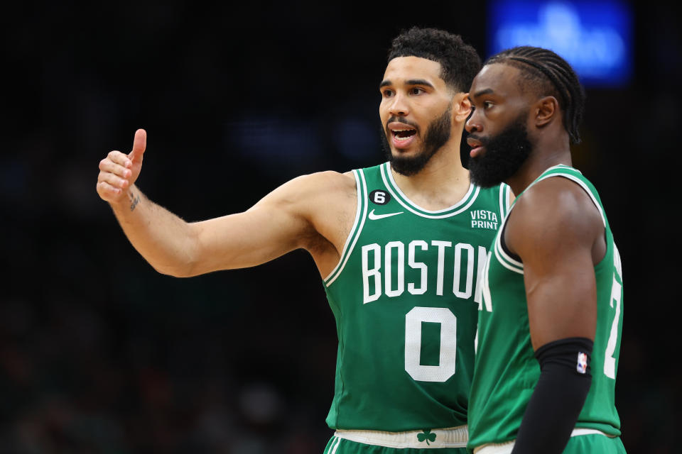 BOSTON, MASSACHUSETTS - MAY 25: Jayson Tatum #0 talks with Jaylen Brown #7 of the Boston Celtics against the Miami Heat during the fourth quarter in game five of the Eastern Conference Finals at TD Garden on May 25, 2023 in Boston, Massachusetts. NOTE TO USER: User expressly acknowledges and agrees that, by downloading and or using this photograph, User is consenting to the terms and conditions of the Getty Images License Agreement. (Photo by Maddie Meyer/Getty Images)