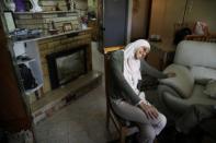 Arab-Israeli poet Dareen Tatour, 35, laughs during an interview with Reuters at her house in Reineh, northern Israel September 26, 2017. Picture taken September 26, 2017. REUTERS/Ammar Awad