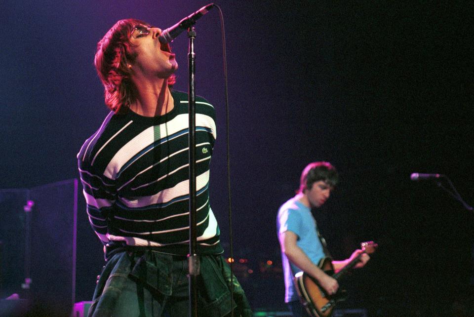 BELGIUM - MARCH 23:  Photo of Liam GALLAGHER and Noel GALLAGHER and OASIS; Liam Gallagher and Noel Gallagher performing live onstage at Ancienne Belgique  (Photo by Paul Bergen/Redferns)