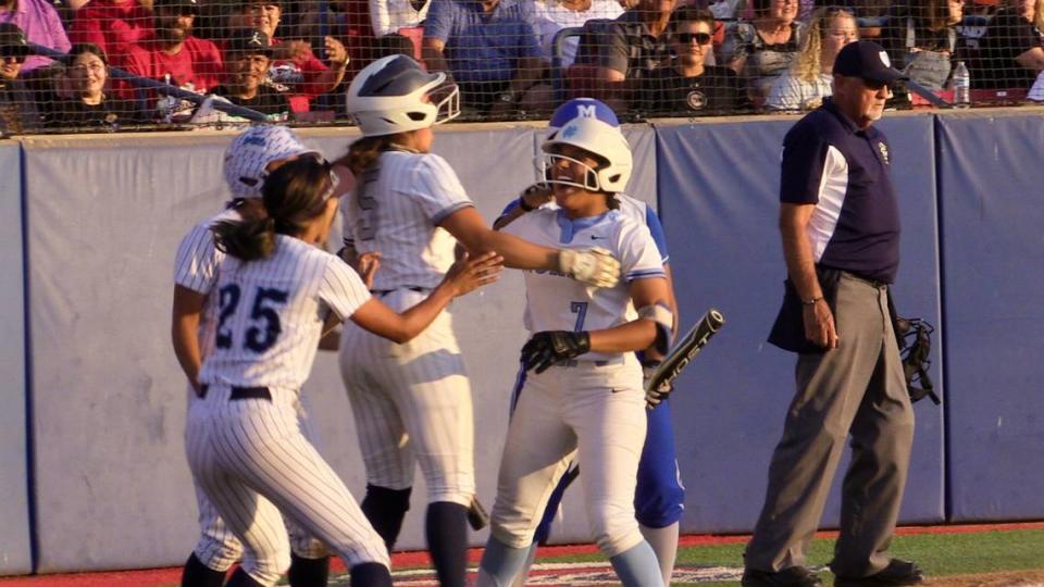 Naleya Bridges of Clovis North celebrates with City teammates after she had an inside-the-park home run at the City/County All-Star high school softball game at Margie Wright Diamond at Fresno State on Wednesday, June 21, 2023.