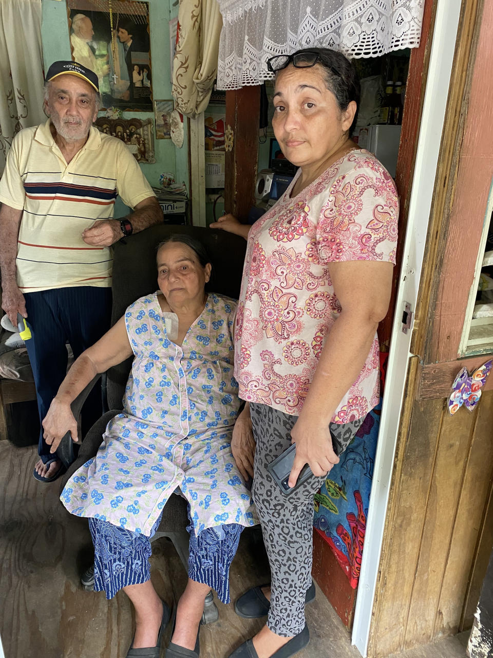 Carmen Cruz Vázquez, right, with her parents, Carmen Vázquez Ramos and Juan Cruz Camacho, in their home in San Germán, Puerto Rico. (Daniella Silva / NBC News)