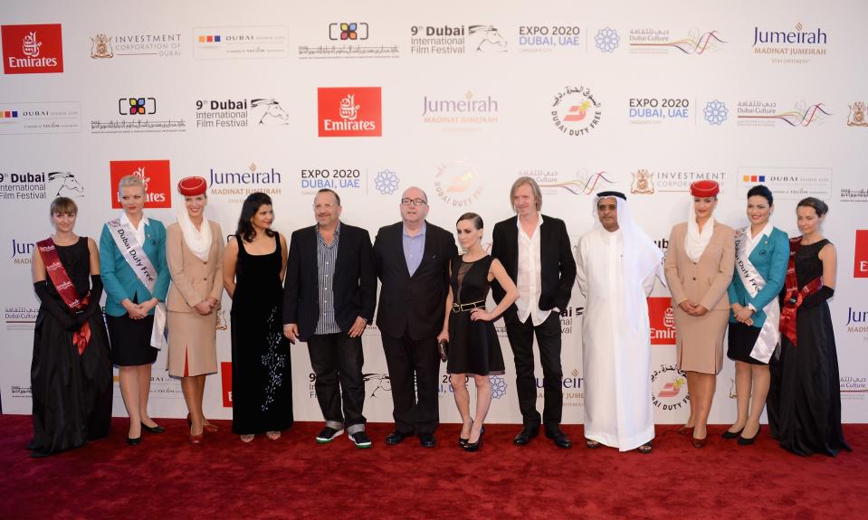 DUBAI, UNITED ARAB EMIRATES - DECEMBER 11: Managing director of DIFF Shivani Pandya, producers Aron Warner, Jacques Methe, actress Erica Linz, director Andrew Adamson and DIFF Chairman Abdulhamid Juma attend the "Cirque du Soleil: Worlds Away 3D" premiere during day three of the 9th Annual Dubai International Film Festival held at the Madinat Jumeriah Complex on December 11, 2012 in Dubai, United Arab Emirates. (Photo by Andrew H. Walker/Getty Images for DIFF)