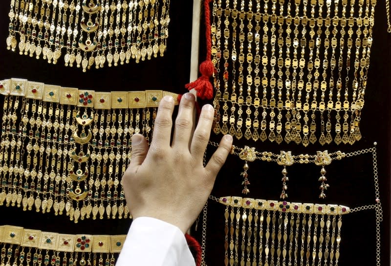 FILE PHOTO: Saudi man displays jewellery at a store in Riyadh