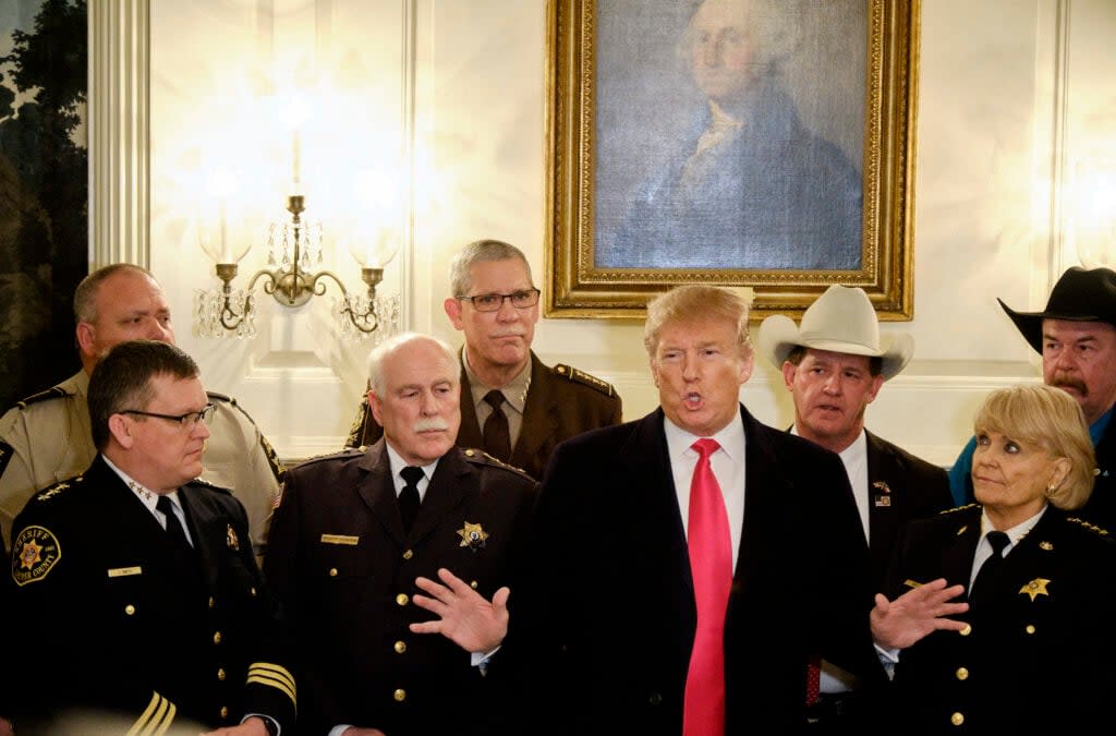 U.S. President Donald Trump speaks to the media after meeting with sheriffs from across the country in the Diplomatic Reception Room at the White House February 11, 2019 in Washington, D.C. (Photo by T.J. Kirkpatrick-Pool/Getty Images)