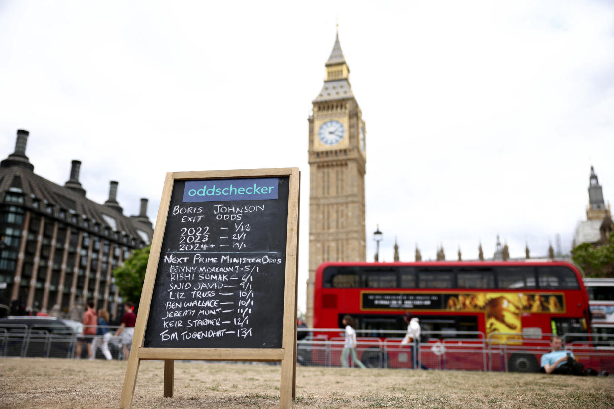 Boris Johnson: A board is seen as demonstrators protest against British Prime Minister Boris Johnson, in London